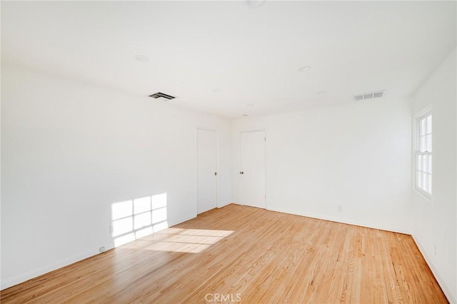 unfurnished room featuring wood finished floors