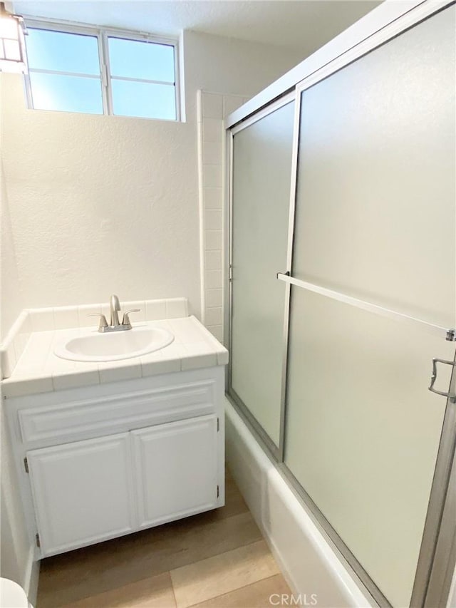 2706 Grant Ave Unit A, Redondo Beach, CA 90278 - full bath with vanity, enclosed tub / shower combo, and a textured wall