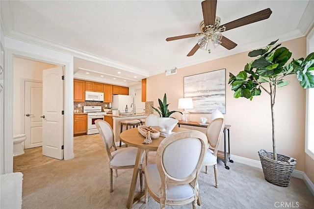 173 N Magnolia Ave Unit A, Anaheim, CA 92801 - dining room with light carpet, crown molding, recessed lighting, ceiling fan, and baseboards