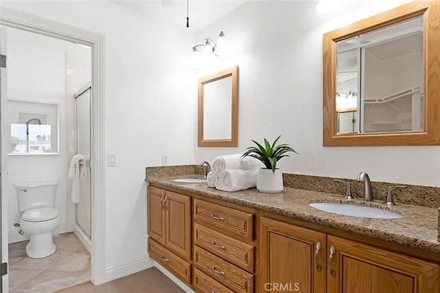 173 N Magnolia Ave Unit A, Anaheim, CA 92801 - bathroom featuring double vanity, a shower stall, toilet, tile patterned flooring, and baseboards