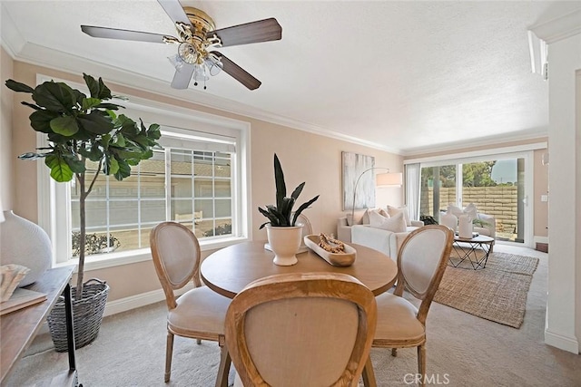 173 N Magnolia Ave Unit A, Anaheim, CA 92801 - dining space featuring carpet, baseboards, ornamental molding, and a ceiling fan