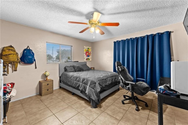 115 N Magnolia Ct, Compton, CA 90220 - bedroom featuring a textured ceiling, light tile patterned floors, and a ceiling fan