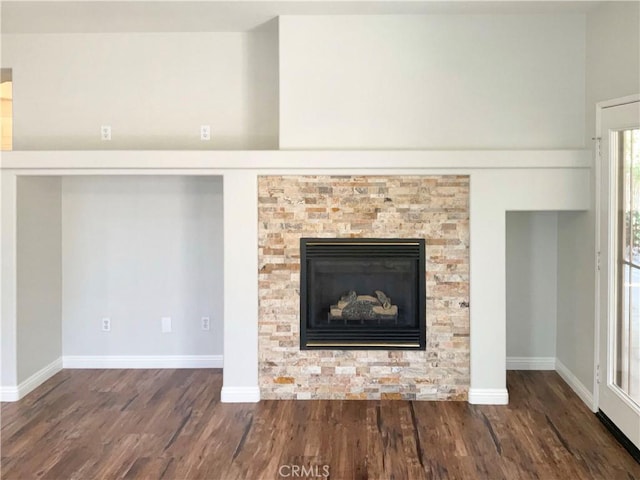 8424 Monique Ct, Riverside, CA 92508 - detailed view of wood finished floors, baseboards, and a fireplace