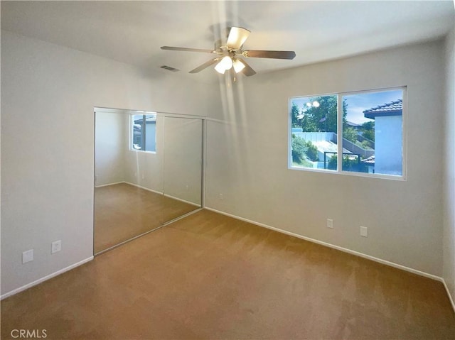 8424 Monique Ct, Riverside, CA 92508 - unfurnished bedroom with carpet, multiple windows, and baseboards