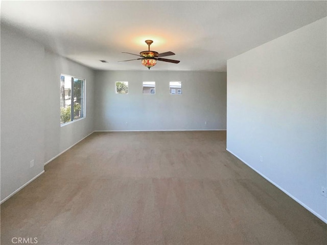 8424 Monique Ct, Riverside, CA 92508 - empty room featuring a ceiling fan, light colored carpet, and baseboards