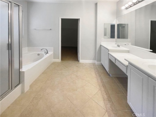 8424 Monique Ct, Riverside, CA 92508 - full bath featuring tile patterned flooring, a bath, vanity, a shower stall, and baseboards