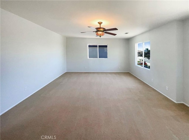 8424 Monique Ct, Riverside, CA 92508 - spare room with light colored carpet, a ceiling fan, and baseboards