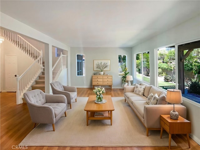 8424 Monique Ct, Riverside, CA 92508 - living room with stairs, wood finished floors, and baseboards