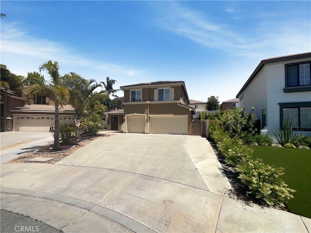 8424 Monique Ct, Riverside, CA 92508 - view of front facade with stucco siding, a garage, and driveway