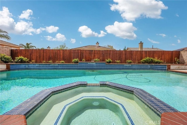 870 E Bermuda Dunes Ct, Ontario, CA 91761 - view of pool featuring fence and a pool with connected hot tub