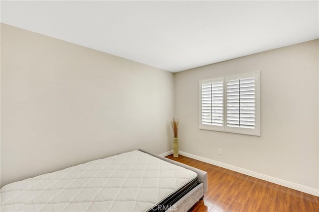 870 E Bermuda Dunes Ct, Ontario, CA 91761 - bedroom with baseboards and wood finished floors