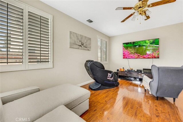 870 E Bermuda Dunes Ct, Ontario, CA 91761 - living room featuring wood finished floors, ceiling fan, and baseboards