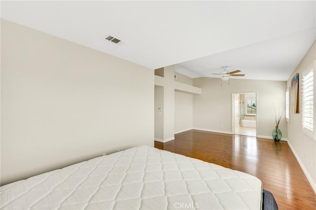 870 E Bermuda Dunes Ct, Ontario, CA 91761 - unfurnished bedroom featuring wood finished floors, baseboards, vaulted ceiling, and a ceiling fan