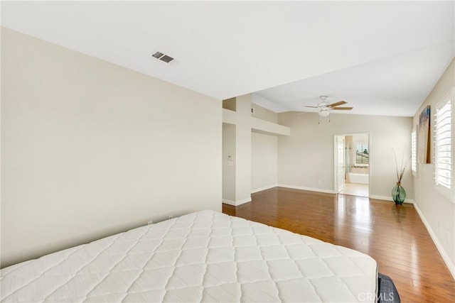870 E Bermuda Dunes Ct, Ontario, CA 91761 - unfurnished bedroom featuring wood finished floors, baseboards, a ceiling fan, and vaulted ceiling