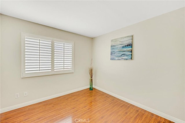870 E Bermuda Dunes Ct, Ontario, CA 91761 - empty room featuring wood finished floors and baseboards