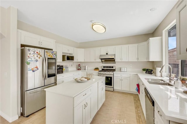 870 E Bermuda Dunes Ct, Ontario, CA 91761 - kitchen with stainless steel appliances, a sink, under cabinet range hood, a center island, and light countertops