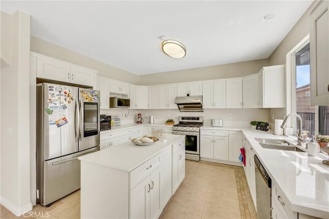 870 E Bermuda Dunes Ct, Ontario, CA 91761 - kitchen with appliances with stainless steel finishes, a sink, under cabinet range hood, a kitchen island, and light countertops