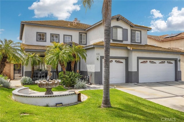 870 E Bermuda Dunes Ct, Ontario, CA 91761 - view of front of home featuring an attached garage, a front yard, stucco siding, and driveway