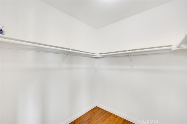 870 E Bermuda Dunes Ct, Ontario, CA 91761 - spacious closet featuring wood finished floors
