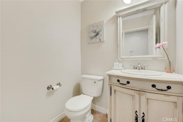 870 E Bermuda Dunes Ct, Ontario, CA 91761 - half bathroom featuring toilet, vanity, and baseboards