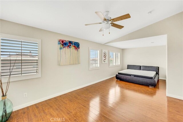 870 E Bermuda Dunes Ct, Ontario, CA 91761 - sitting room with wood finished floors, ceiling fan, baseboards, and lofted ceiling