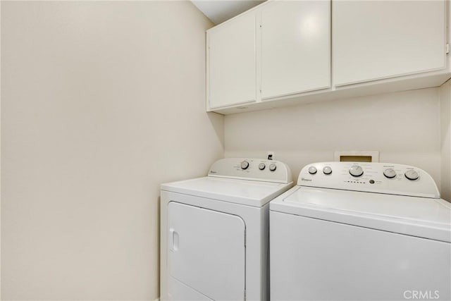 870 E Bermuda Dunes Ct, Ontario, CA 91761 - laundry area featuring cabinet space and washing machine and clothes dryer
