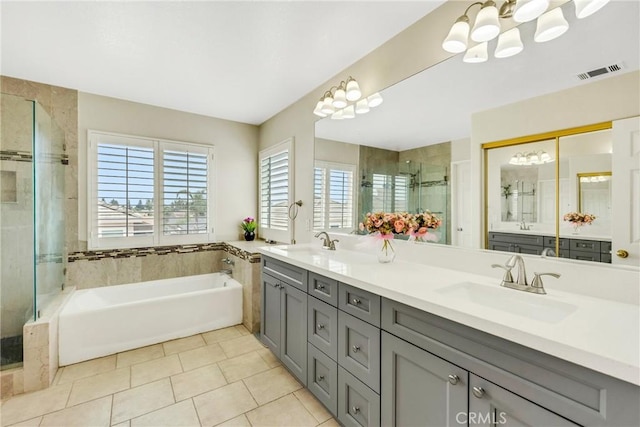 870 E Bermuda Dunes Ct, Ontario, CA 91761 - full bathroom with a chandelier, a shower stall, a garden tub, and double vanity