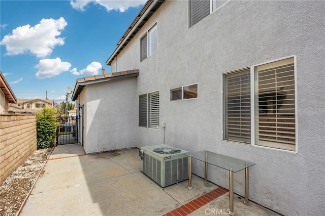 870 E Bermuda Dunes Ct, Ontario, CA 91761 - view of patio / terrace with cooling unit, fence, and a gate