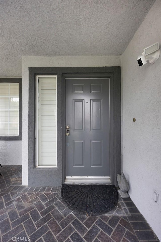 870 E Bermuda Dunes Ct, Ontario, CA 91761 - property entrance featuring stucco siding