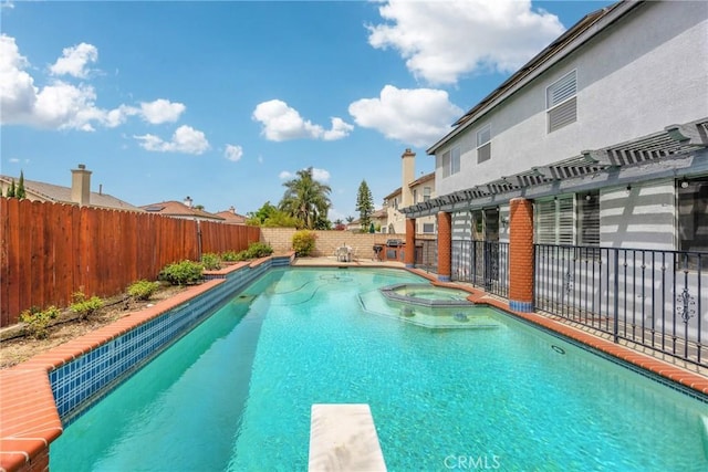 870 E Bermuda Dunes Ct, Ontario, CA 91761 - view of pool with a fenced backyard, a pool with connected hot tub, and a diving board