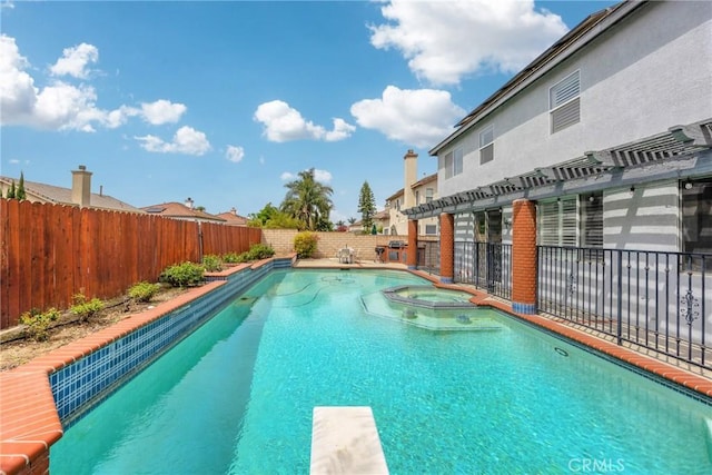 870 E Bermuda Dunes Ct, Ontario, CA 91761 - view of swimming pool with a fenced backyard, a pool with connected hot tub, and a diving board