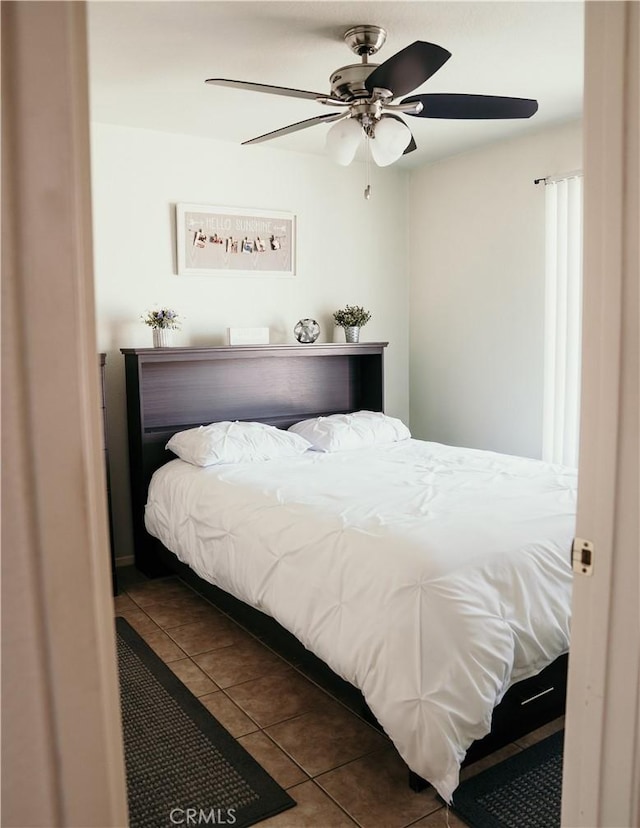25657 Tamarisk St, Barstow, CA 92311 - tiled bedroom featuring ceiling fan