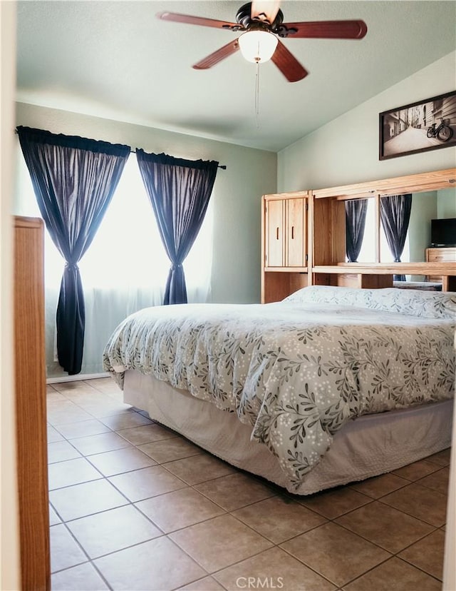 25657 Tamarisk St, Barstow, CA 92311 - bedroom featuring light tile patterned floors, lofted ceiling, and a ceiling fan
