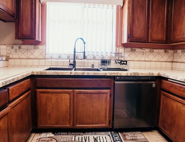 25657 Tamarisk St, Barstow, CA 92311 - kitchen featuring dishwasher, a sink, tasteful backsplash, and light countertops