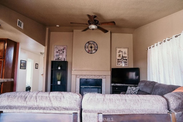 25657 Tamarisk St, Barstow, CA 92311 - living area with a ceiling fan and a fireplace