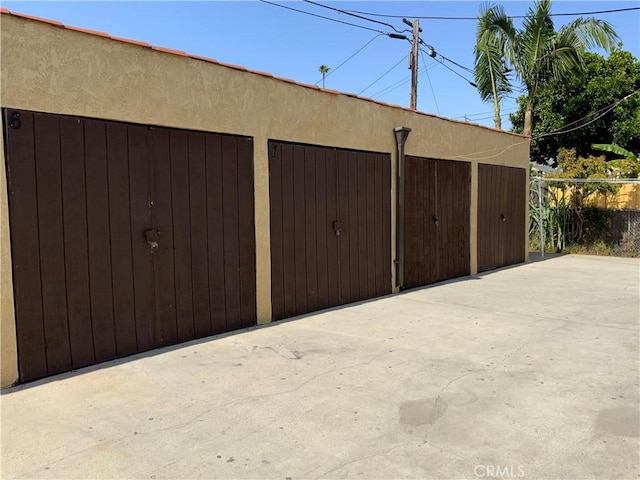 garage featuring fence