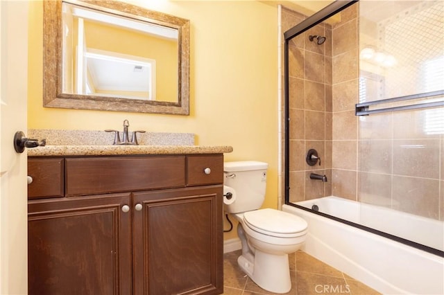 10148 Fernglen Ave Unit 2, Tujunga, CA 91042 - bathroom with vanity, tile patterned floors, toilet, baseboards, and combined bath / shower with glass door