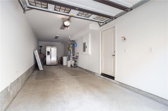 10148 Fernglen Ave Unit 2, Tujunga, CA 91042 - garage featuring stainless steel fridge, electric panel, and secured water heater