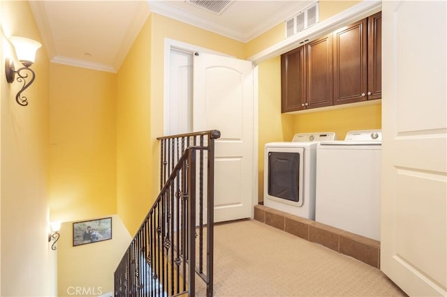 10148 Fernglen Ave Unit 2, Tujunga, CA 91042 - laundry room featuring separate washer and dryer, cabinet space, light colored carpet, and ornamental molding