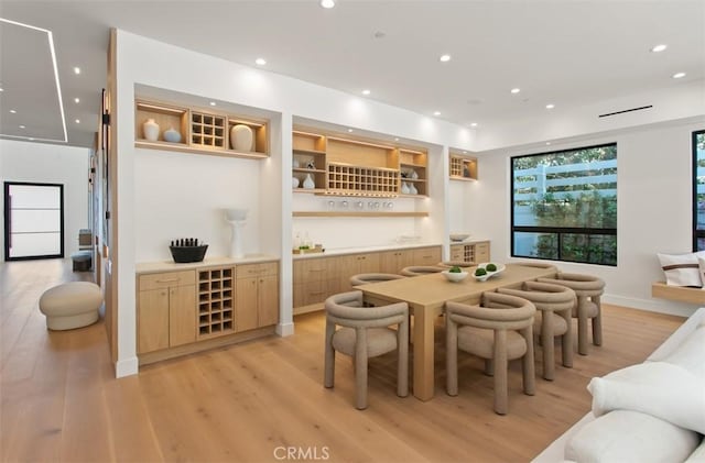 5772 Sierra Casa Rd, Irvine, CA 92603 - dining area with light wood-style floors, recessed lighting, wet bar, and baseboards