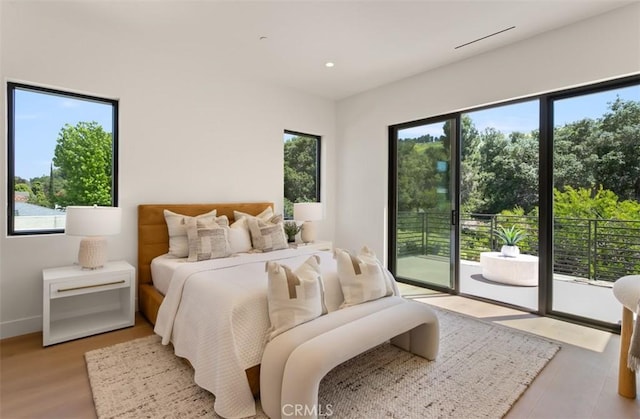 5772 Sierra Casa Rd, Irvine, CA 92603 - bedroom featuring access to outside, multiple windows, recessed lighting, baseboards, and wood finished floors