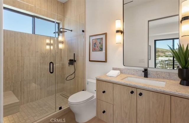 5772 Sierra Casa Rd, Irvine, CA 92603 - bathroom featuring vanity, toilet, and a shower stall