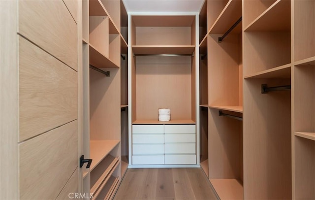 5772 Sierra Casa Rd, Irvine, CA 92603 - spacious closet featuring wood finished floors