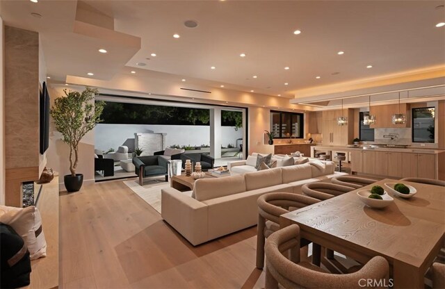 5772 Sierra Casa Rd, Irvine, CA 92603 - living room with light wood-style floors and recessed lighting