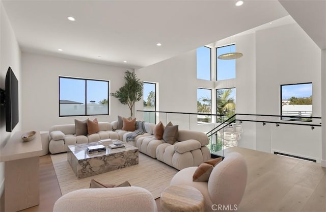 5772 Sierra Casa Rd, Irvine, CA 92603 - living area featuring recessed lighting, light wood finished floors, and a baseboard heating unit