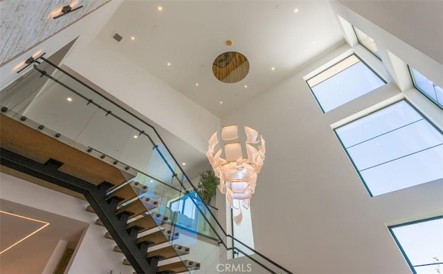5772 Sierra Casa Rd, Irvine, CA 92603 - staircase with a towering ceiling and recessed lighting