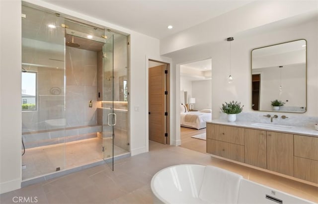5772 Sierra Casa Rd, Irvine, CA 92603 - bathroom featuring a stall shower, vanity, baseboards, a freestanding bath, and recessed lighting