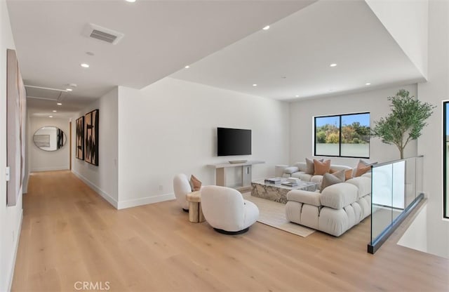 5772 Sierra Casa Rd, Irvine, CA 92603 - living room featuring light wood finished floors, recessed lighting, and baseboards