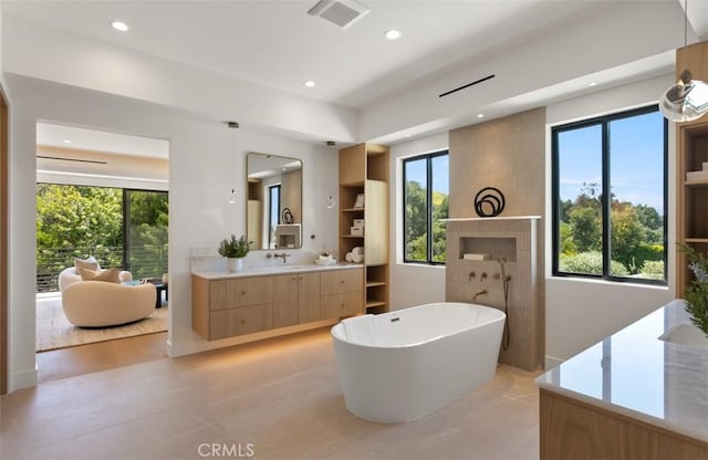 5772 Sierra Casa Rd, Irvine, CA 92603 - bathroom with vanity, a soaking tub, and recessed lighting