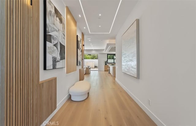 5772 Sierra Casa Rd, Irvine, CA 92603 - hallway with light wood-type flooring, baseboards, and recessed lighting